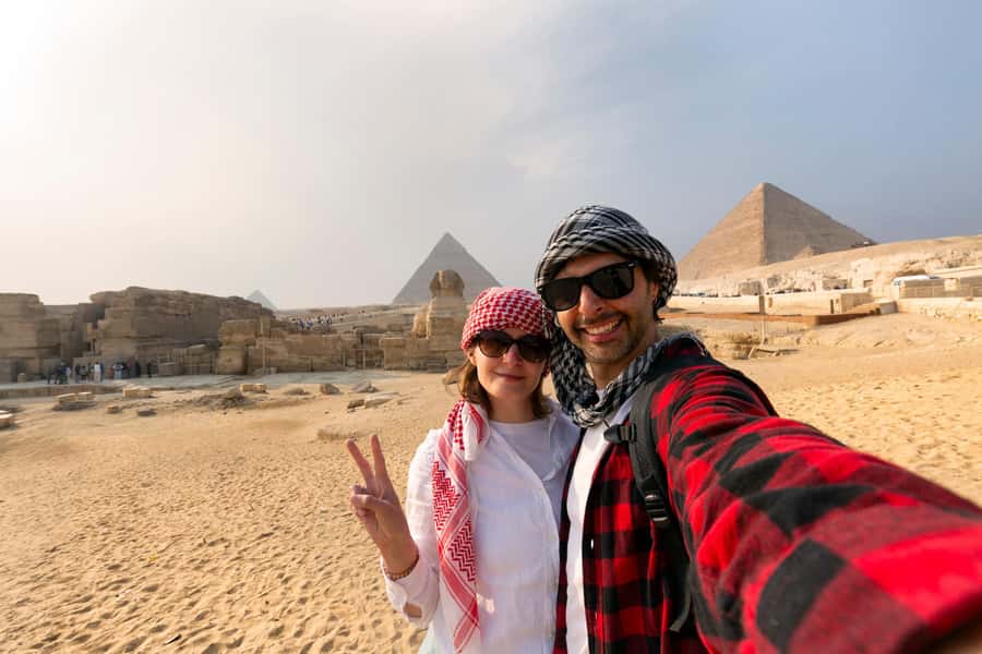 Cairo: Private Tour to Giza Pyramids with Camel Ride & Lunch - Riding a camel with pyramid views