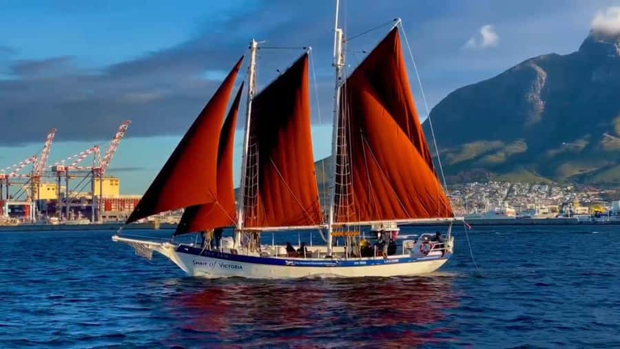 Cape Town: Sunset Cruise from V&A Waterfront with Bubbly - Leaving the V&A Waterfront under red-brown sails