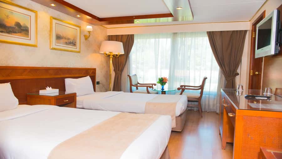 From Aswan: Overnight Nile Cruise to Luxor with Meals - Sailing past villages and desert banks