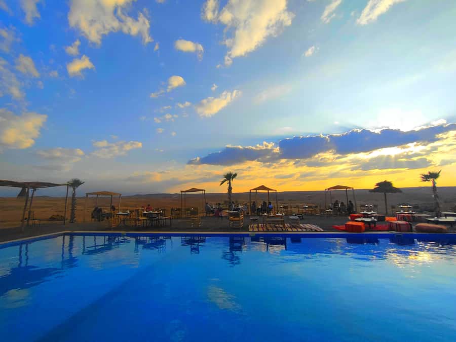 From Marrakech: Agafay Desert Sunset Dinner with Live Show - Leaving Marrakech for Agafay at sunset