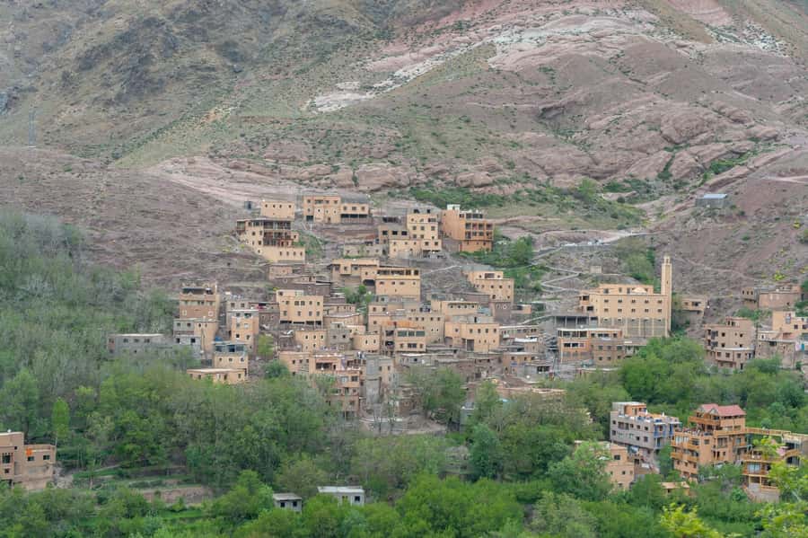 From Marrakech: Atlas Mountains Summit Trek - The descent through villages and the Tidli Plateau