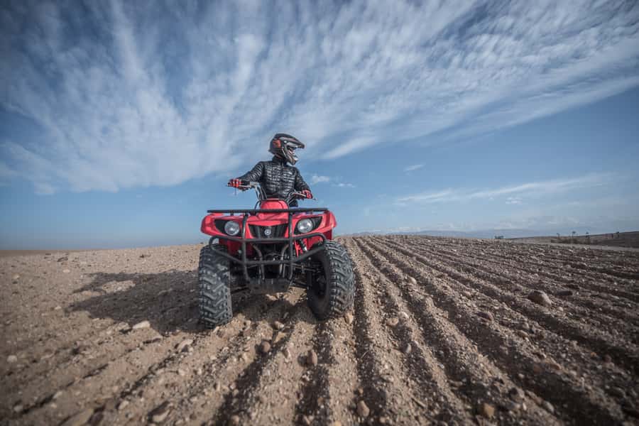 From Marrakech: Premium Agafay Desert Half-Day Quad Biking - Riding through hills and dry riverbeds