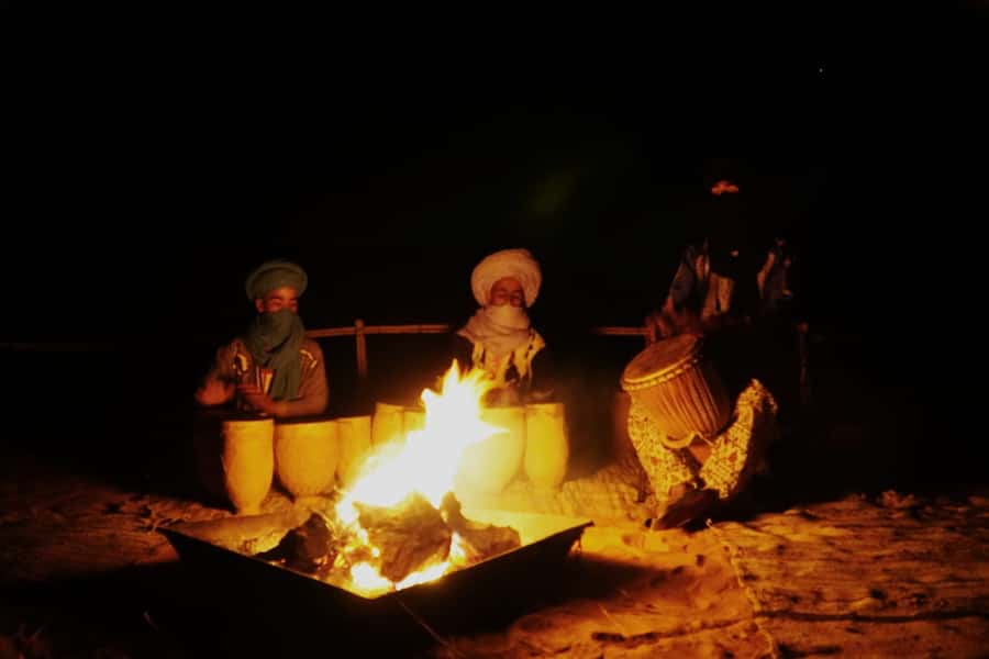 From Merzouga: Desert Overnight in Heated Tent & Camel Ride - Drums, fire, and the starry sky