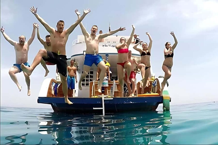 Hurghada: Dolphin Watching Boat Tour with Snorkeling & Lunch - Banana boats and a playful finish