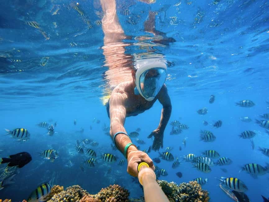 Hurghada: Orange Bay Day Trip with Water Sports and Lunch - Two coral reef stops with gear and guidance