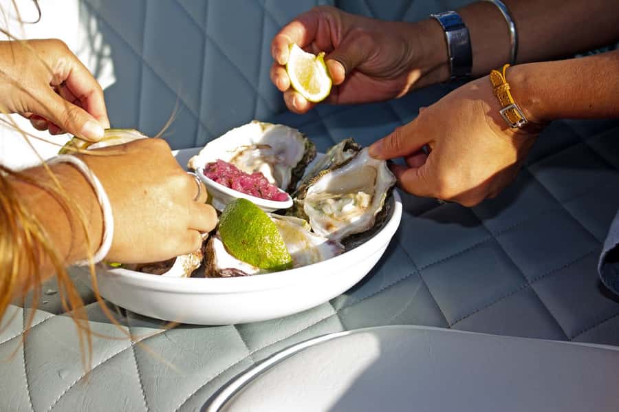 Knysna: Sunset Lagoon Cruise - Oysters, champagne, and the real cost