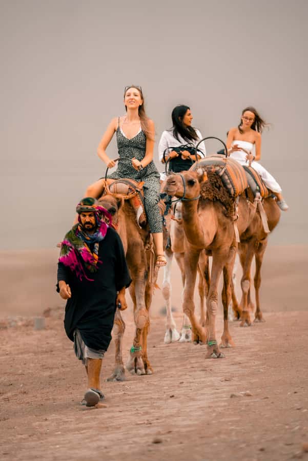 Marrakech: Agafay Desert Sunset, Camel Ride, and Dinner Show - Moroccan dinner at the camp