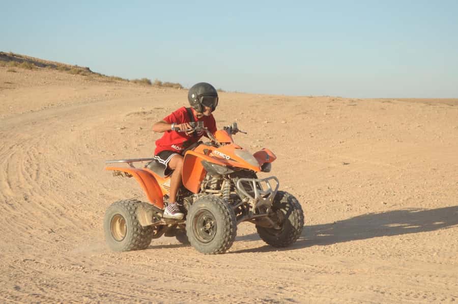 Marrakech: Agafay Desert Trip with Activities and Dinner - Quad biking across the rocky desert