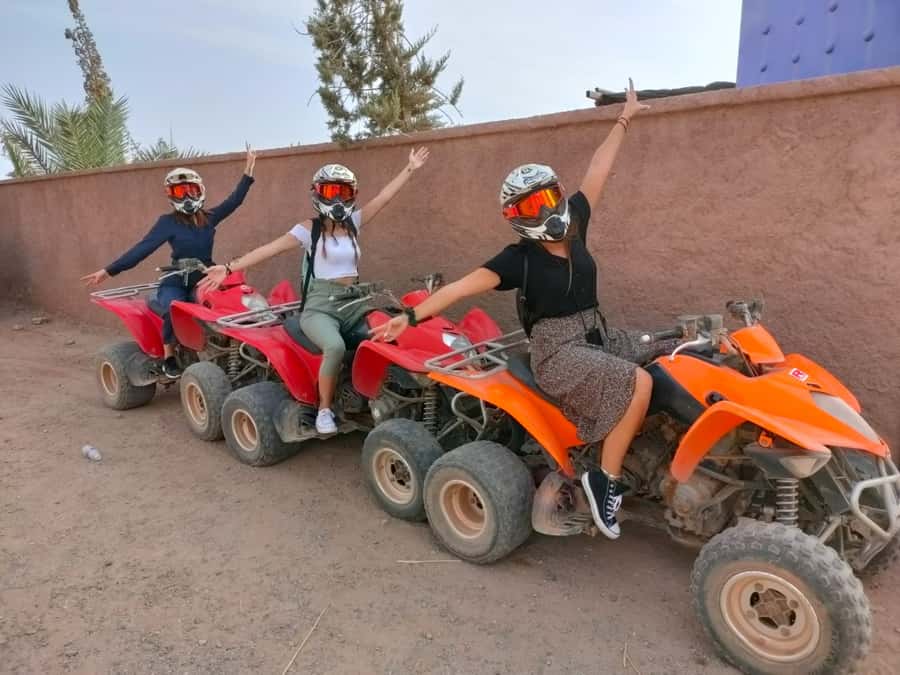 Marrakech: Palmeraie Quad Bike & Traditional Moroccan Spa - Quad bikes among palms, rocks, and desert views