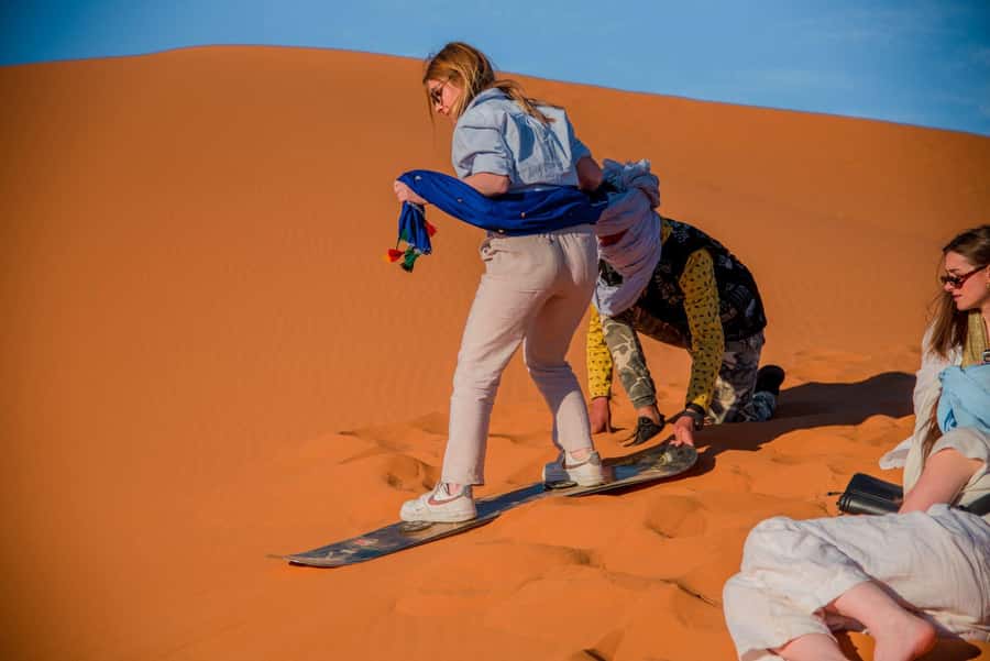 Marrakech to Fes: 3-Day Merzouga Desert Camel & Sandboarding - Walking beneath the cliffs of Todra Gorge