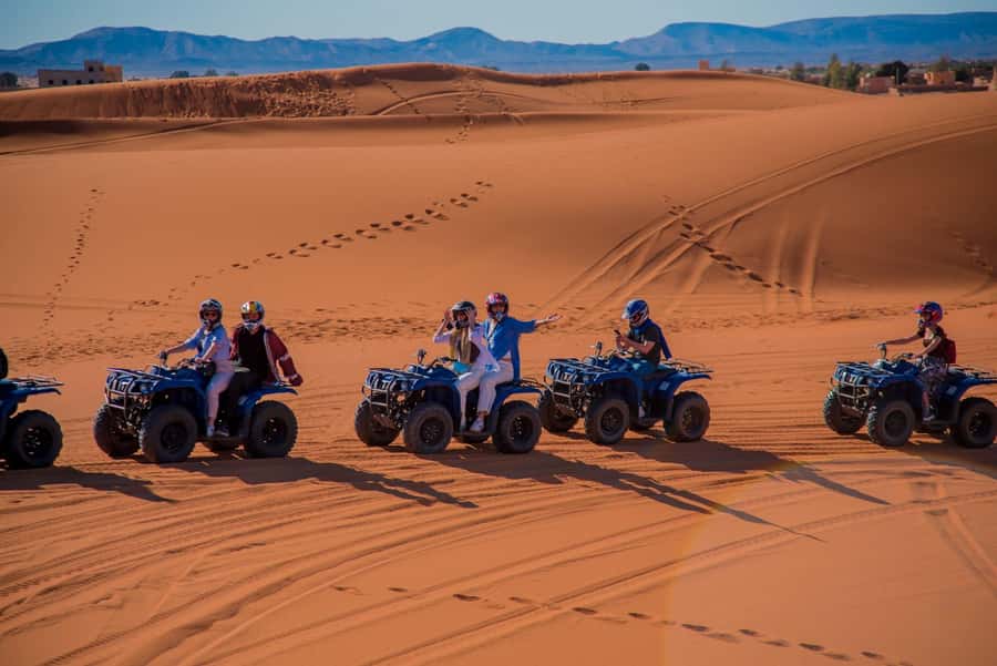 Merzouga : Adventure Quad Bike Safari, & Sandboarding - Racing across the Merzouga dunes