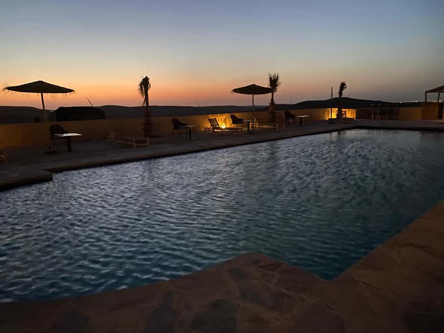Unforgettable Desert Night: Dinner, Camel Ride & Quad Bike - Quad biking across the desert at sunset