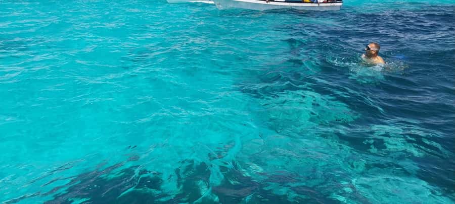 Zanzibar: Mnemba Island Dolphin and Snorkeling Tour - Sandbanks, shallow water, and fresh fruit